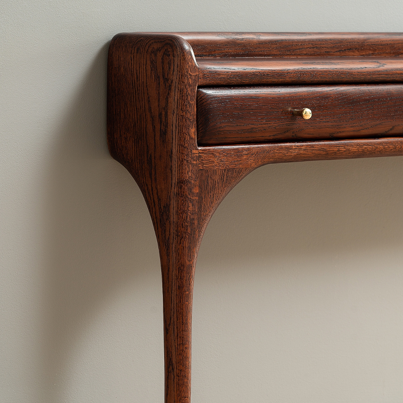 Detail of CT 01 console by Tomasz Omachel Studio showing sculptural woodworking construction