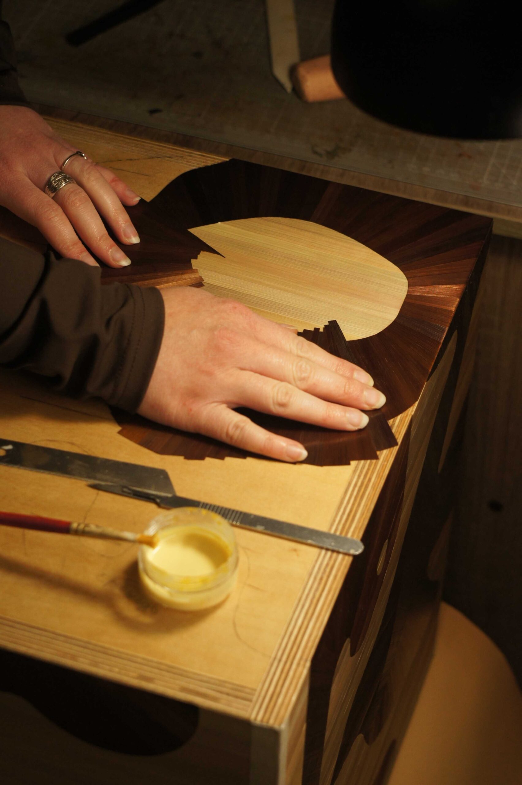 Detail of the handcrafted surface process for the TOTEM side table by RUDA Studio