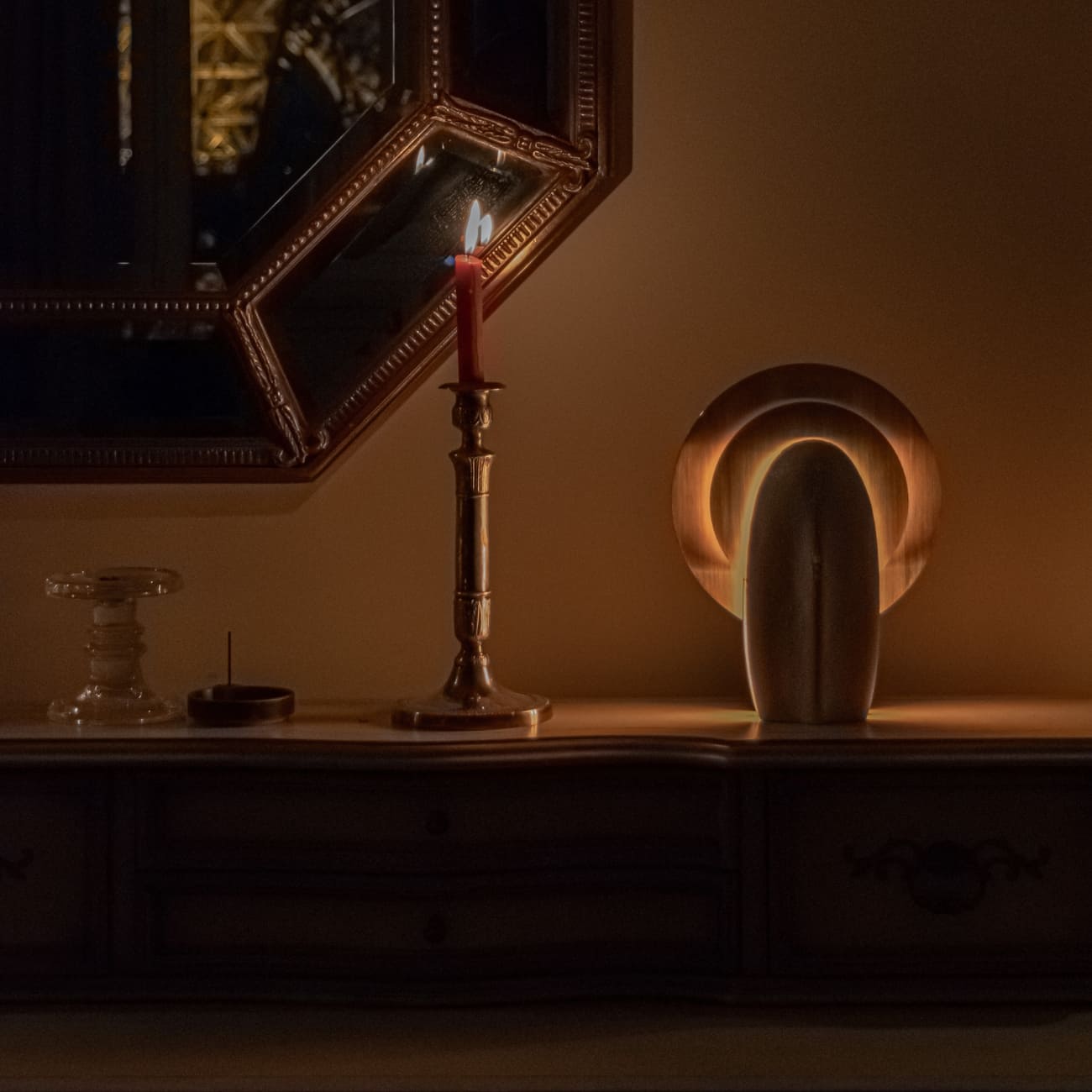 Mother of the Light emitting a warm glow in an evening interior