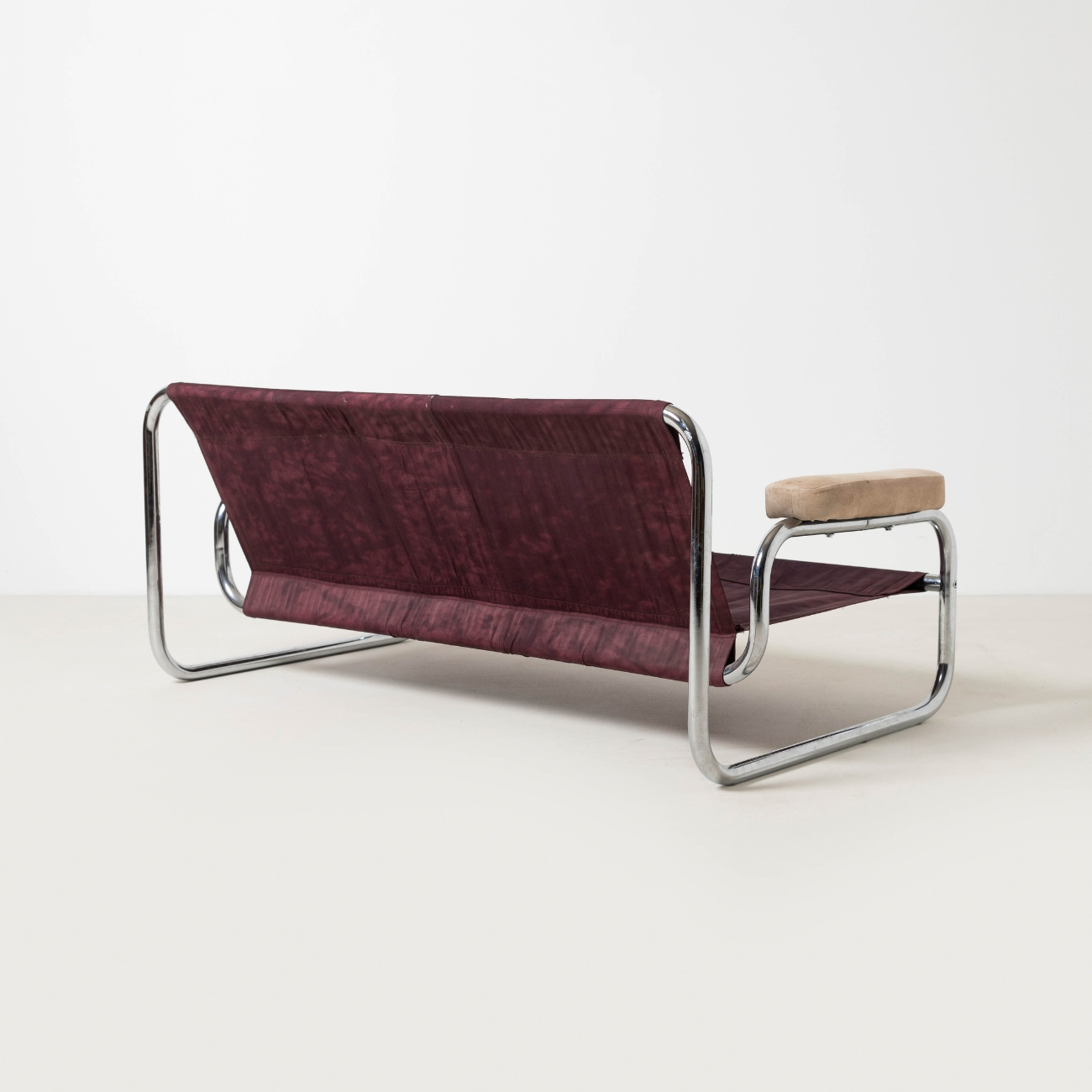 Original textile suspension and chrome frame of the IKEA Borkum sofa.