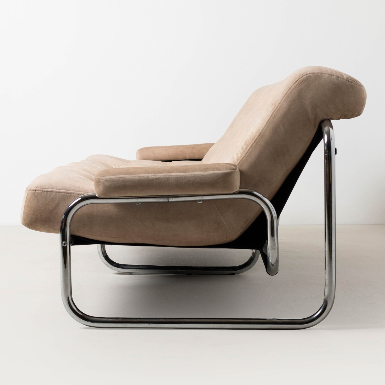 Profile of the Borkum three seater sofa with chrome tubular frame.