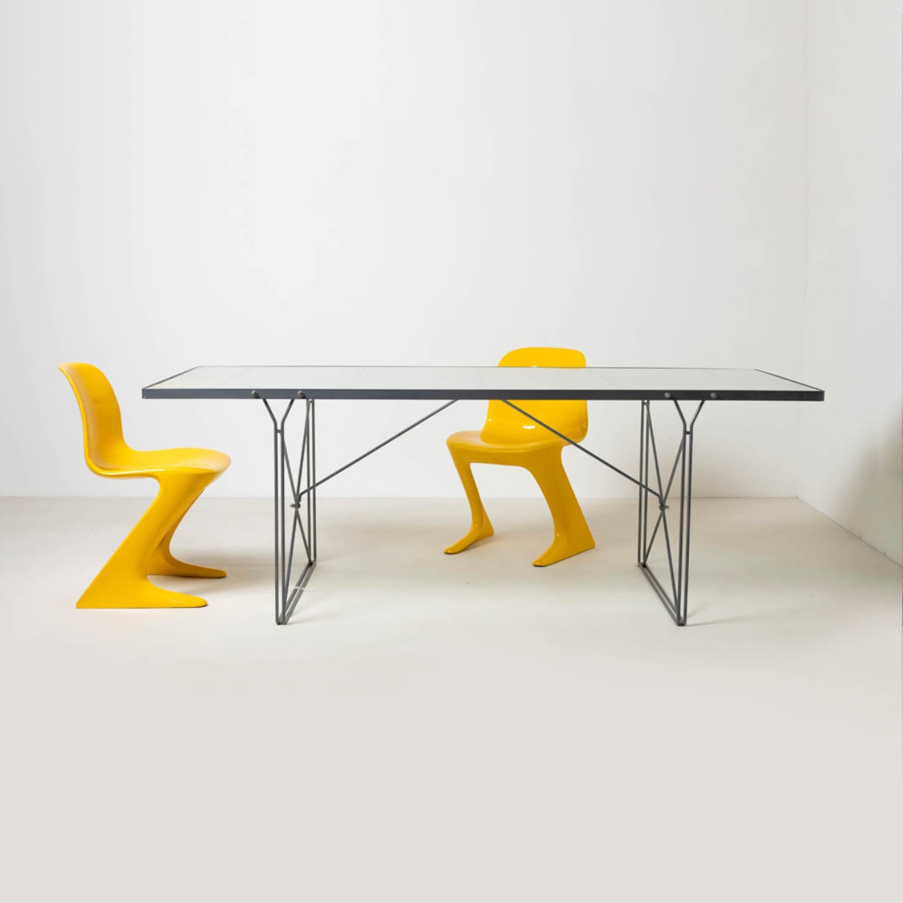IKEA Moment table with frosted glass top and steel frame.