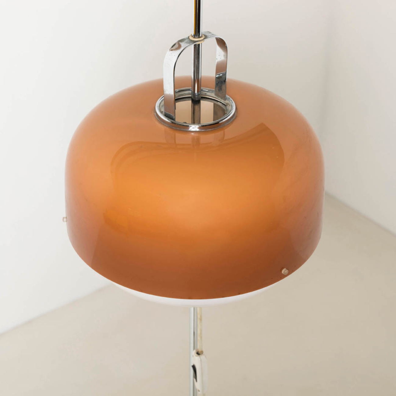Chrome support and upper section of the brown shade on the Medusa floor lamp by Luigi Massoni.
