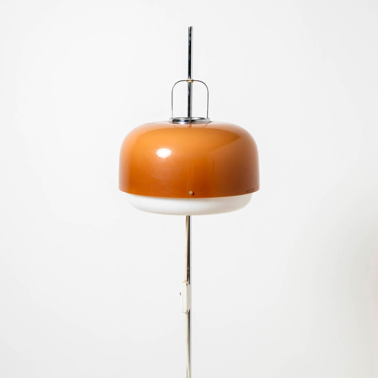Detail of the hemispherical Medusa lamp shade with chrome support.