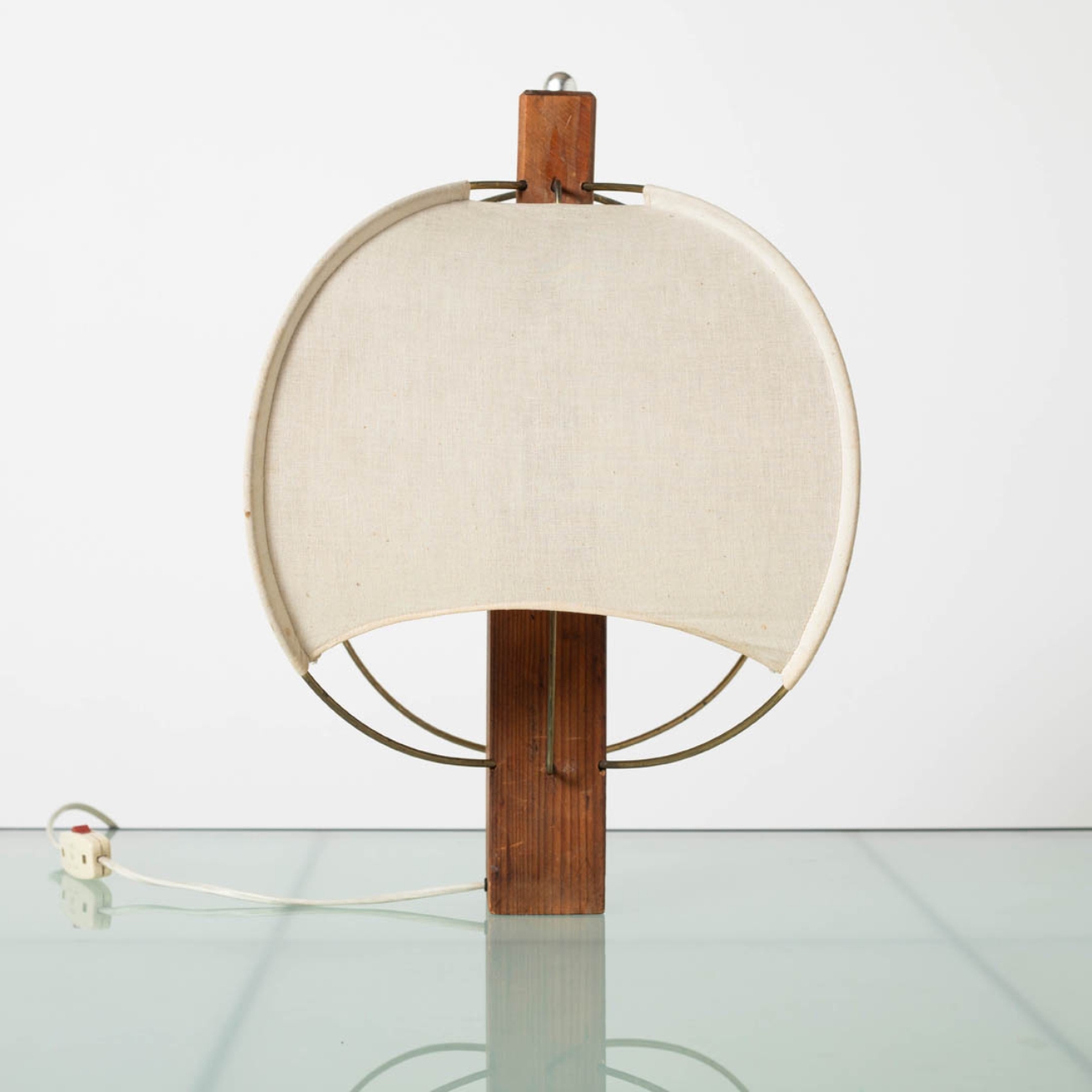 Table lamp with wooden base and fabric shade, front view.
