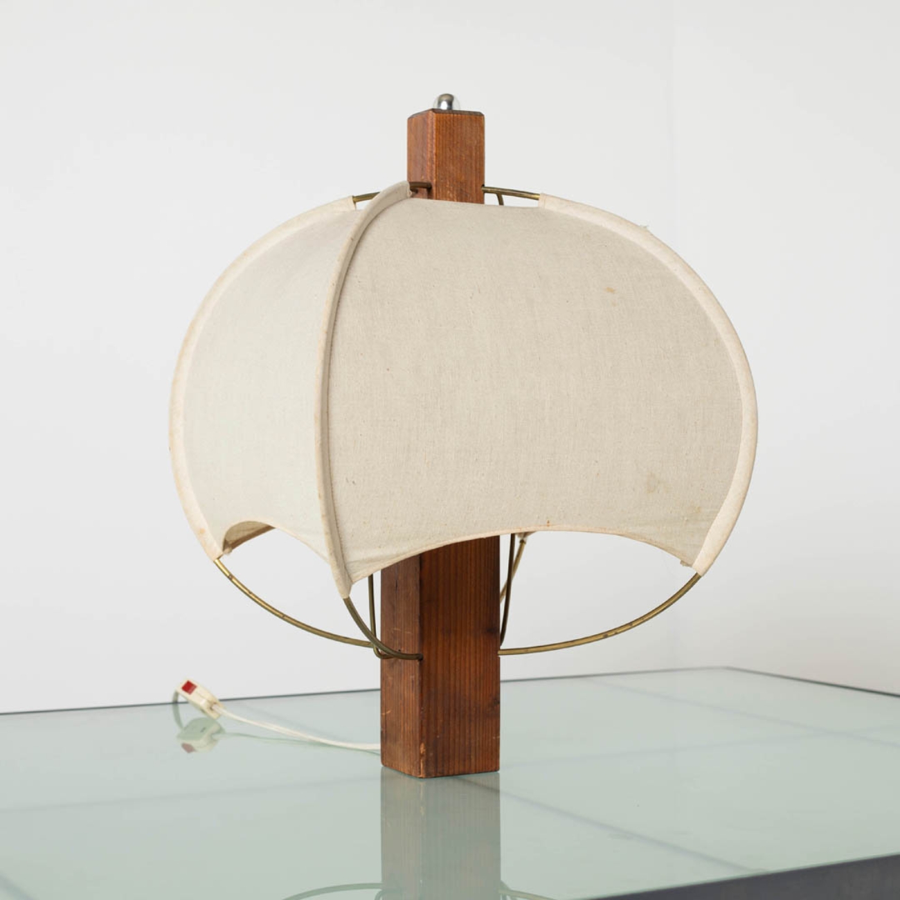 Postmodern table lamp with fabric shade, angled view.