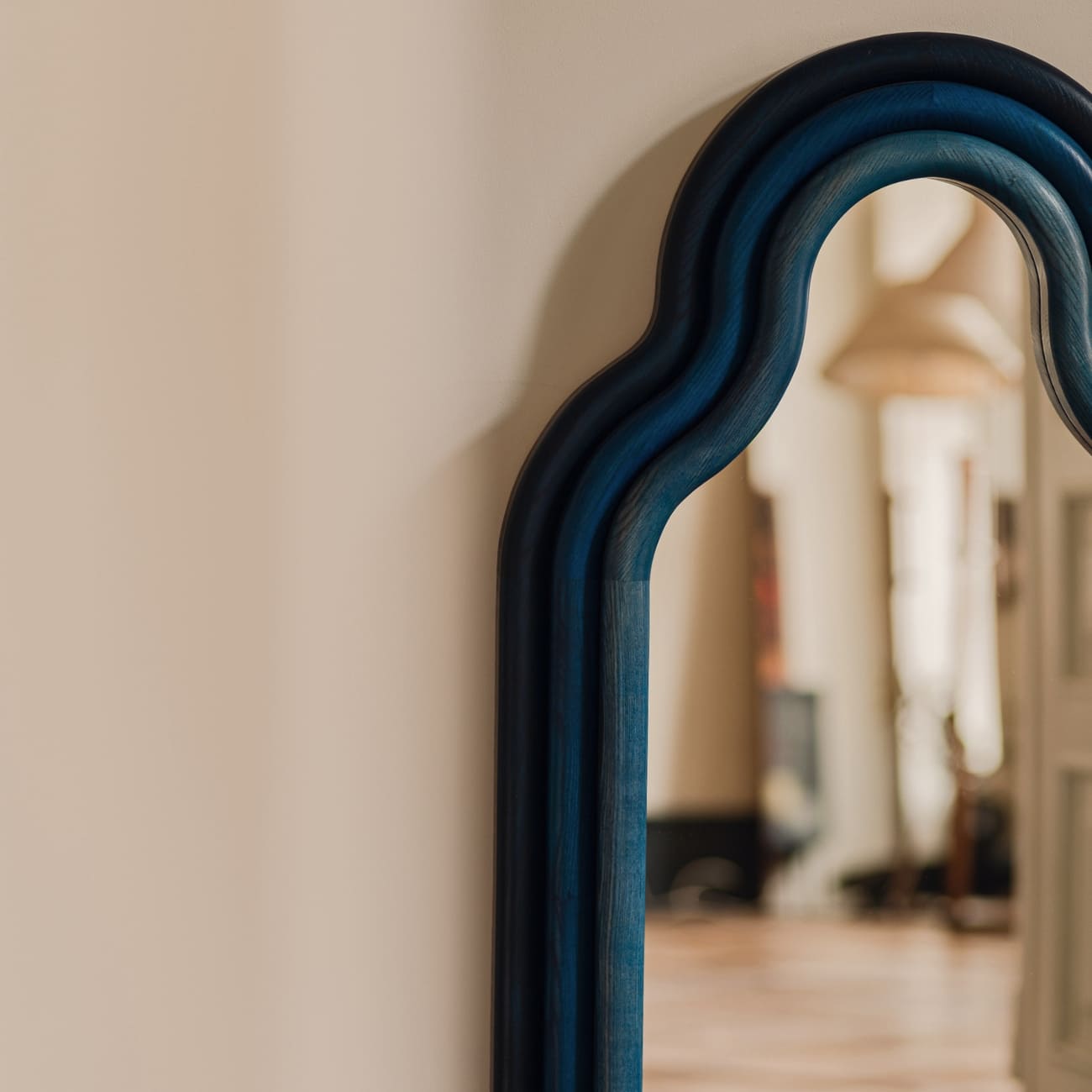 Solid ash wood designer wall mirror by Pani Jurek, part of the TRN series, selected by maybel for collectors of functional art and contemporary design.