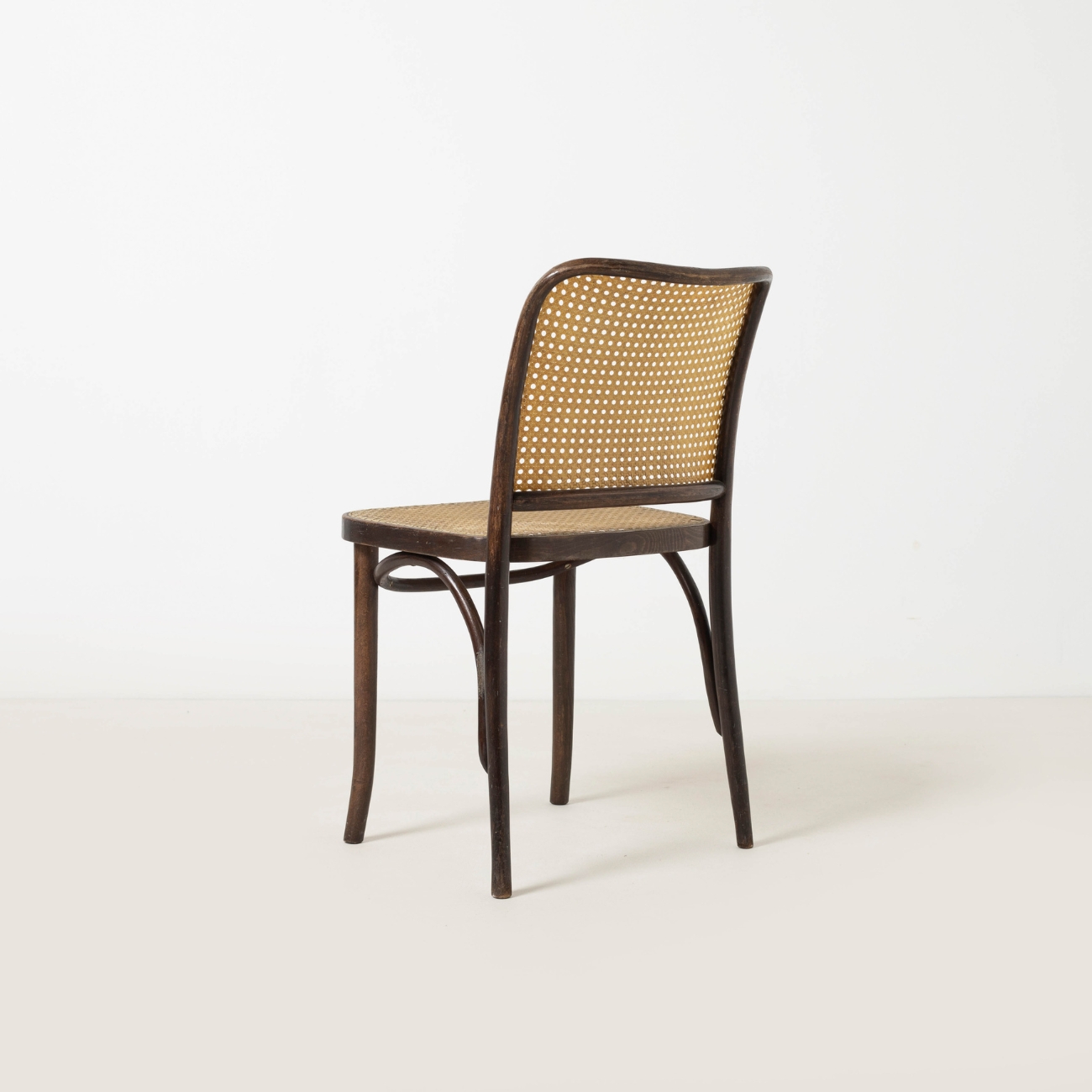 Detailed view of the woven cane backrest of Model 811 chair